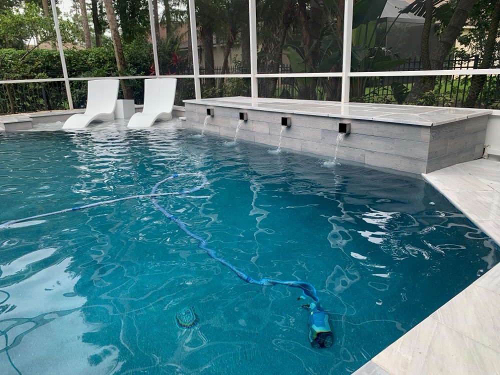 Rock waterfall to scupper wall + loungers — after, view 1
